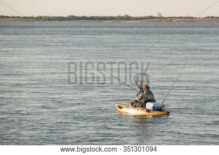 Fisherman In The Sea And Relax Day