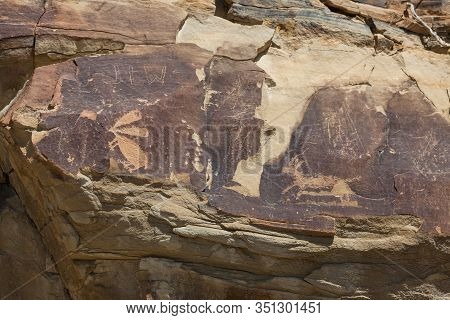 Ancient Petroglyphs Of A Rabbit And A Antelope Are Carved Into Sandstone Rocks Along With Some More 