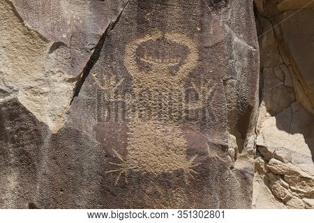 Strange Shapes And Figures That Have Been Carved Into The Ancient Sandstone Rocks At Legend Rock Sta