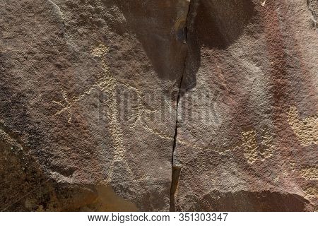 Strange Shapes And Figures That Have Been Carved Into The Ancient Sandstone Rocks At Legend Rock Sta