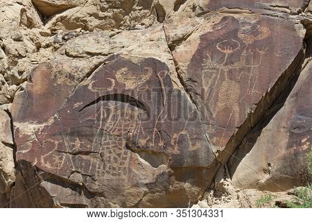 Strange Shapes And Figures That Have Been Carved Into The Ancient Sandstone Rocks At Legend Rock Sta