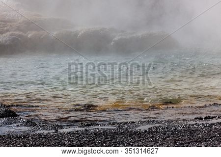 The Formation Of Clepsydra Geyser As Its Shoots Hot Water And Steam Into The Air At Yellowstone Nati