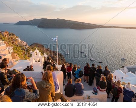 People Watch The Sunset In Oia, Santorini, Greece