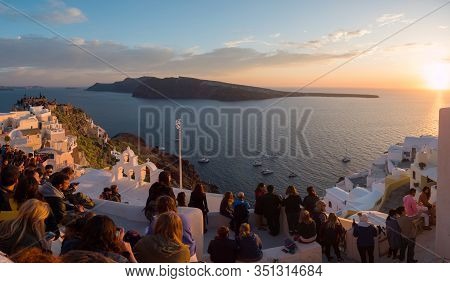 People Watch The Sunset In Oia, Santorini, Greece