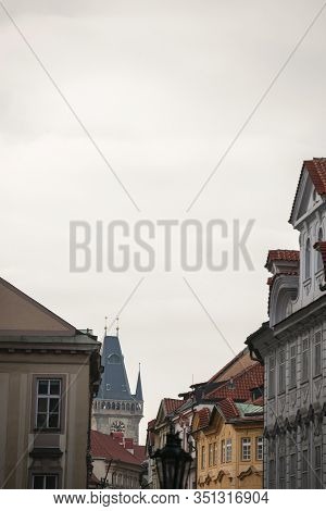 Old Town Hall Tower, A Clock Tower, In Prague, Czech Republic, Surrounded By The Facades Of The Narr