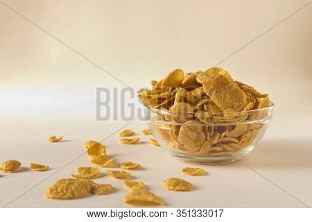 Cornflakes In A Plate On A Light Background. Selective Focus