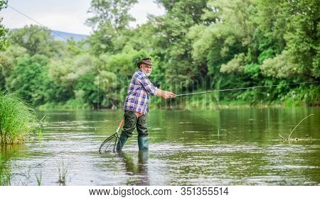 Rural Sports. Retired Bearded Fisher. Trout Bait. Mature Man Fly Fishing. Man Catching Fish. Fisherm