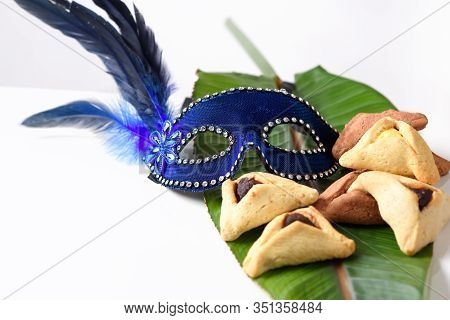 Purim Background With Carnival Mask And Hamantaschen Cookies. Purim Celebration Concept.