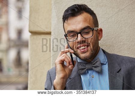Smiling Businessman Talking On The Phone, He Has Good News