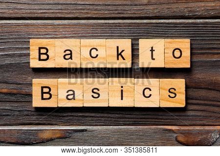 Back To Basics Word Written On Wood Block. Back To Basics Text On Table, Concept