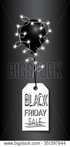Label With Inscription Black Friday Sale Hanging On Black Balloon Decorated With Luminous Garland. T