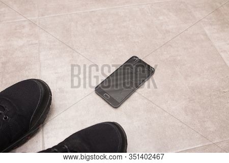 The Black Smartphone Fell Out Of My Hands And The Screen Crashed To Smithereens.
