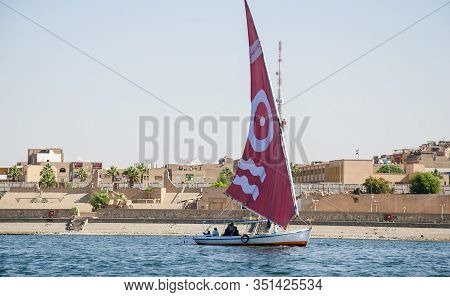 Luxor, Egypt - January 16, 2020 : Felucca Sailboat On The Nile River Near Luxor, Egypt. A Felucca Is