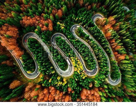 Beautiful Aerial View Of A Curvy Winding Road With Serpentine And Colorful Autumn Trees, Cheia, Dn1a