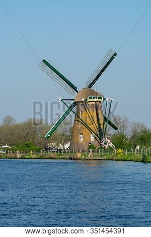 Waterways Of North Holland And View On Traditional Dutch Wind Mill, Dutch Lifestyle Landscape