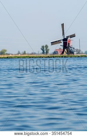 Waterways Of North Holland And View On Traditional Dutch Wind Mill, Dutch Lifestyle Landscape