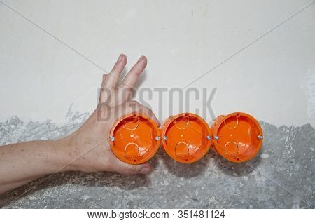 Electrican Repair And Installing Socket Boxes. Outlet Plug. Socket Plug And Plastic Boxes Installati