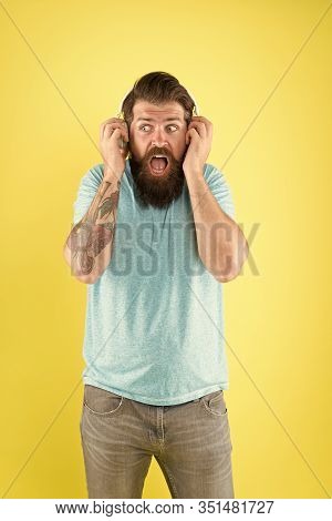 High Voltage Music. Hipster Listen To Music. Bearded Man Wear Headphones Playing Music. Turn Music U