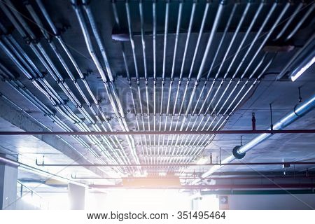 Blurry Picture Of Electrical Conduit And Cabling. Blurry Image For Construction Background.