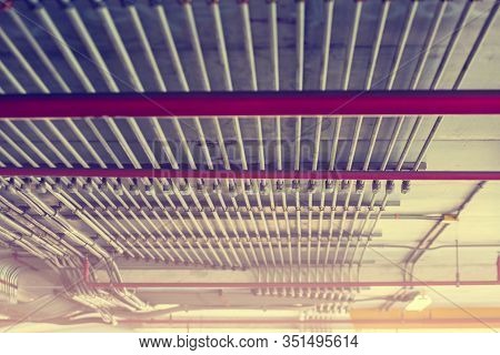 Blurry Picture Of Electrical Conduit And Cabling. Blurry Image For Construction Background.
