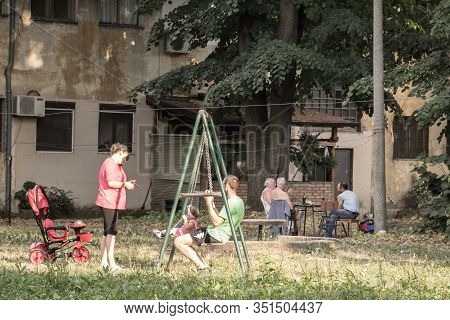 Belgrade, Serbia - August 2, 2015: Serbianamily, A Mother, A Father And Their Daughter, Playing On A