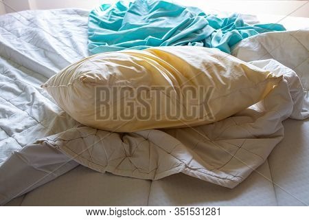 Laundry, Used Ivory Pillow, Used Turquoise Crumpled Bed Sheet On White Bed, Selective Focus, Bedroom