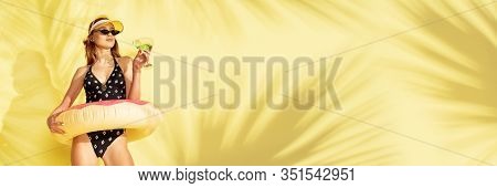 Taste. Caucasian Beautiful Woman In Beach Caps And Swimsuit With Swimring. Yellow Background With Co