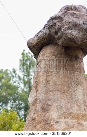 Stonehenge Like Structure In A Zen Theme Garden With A Giant Rock Placed On Top Of A Vertical Standi