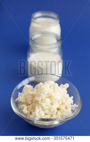 Fermented Drink Kefir In Small Jars And Kefir Grains On A Blue Background Close Up