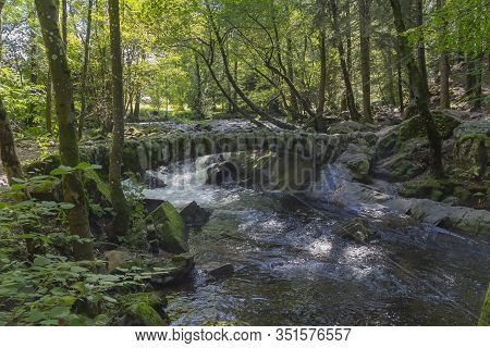 Forest Scenery Around A Small Historic Stone Bridge At The Vologne River Near Gerardmer In The Vosge