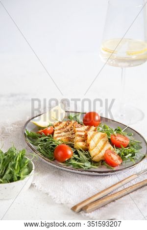 Fresh Salad With Grilled Halumi Cheese, Cherry Tomatoes And Arugula. Copy Space.