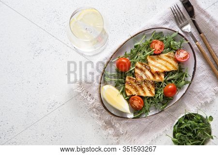 Fresh Salad With Grilled Halumi Cheese, Cherry Tomatoes And Arugula. Copy Space.