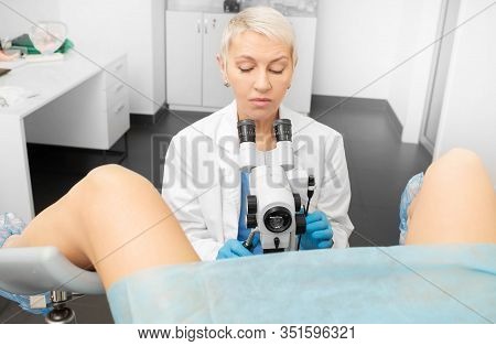 Colposcopy, Examination Of The Cervix. Gynecologist With Colposcope During Examination Of A Woman Pa