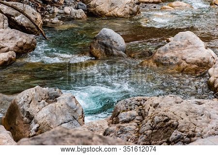 The Mountain River Roudoule In The Low French Alps: The Turquoise Stream Running Through The Rocks