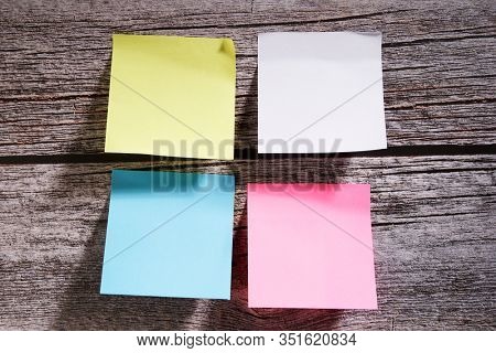 blank spicky note on the wooden background