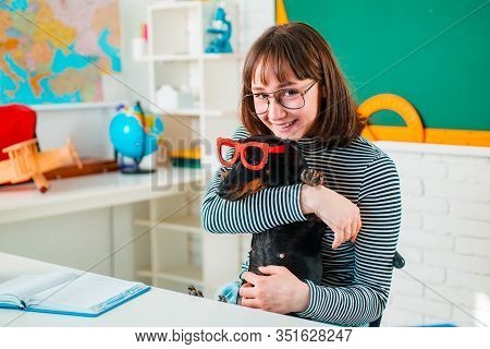 Puppy In Glasses With Funni Student Girl In Glasses. Funny Pupil Looking For A Drawing Concept. Frie