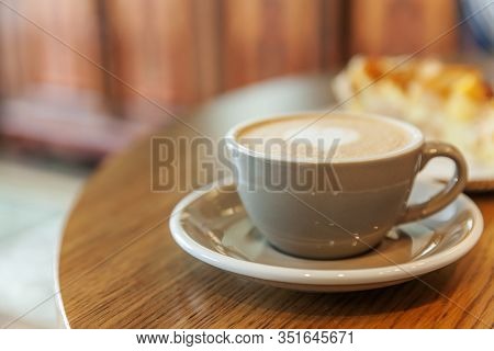 Coffee Cup Fresh Cream Organic Cappuccino On Table In Cafe. Latte Macchiato Drink In Glass Close Up.