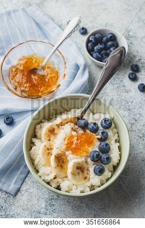 Breakfast With Milk Rice Porridge With Banans, Blueberry And Orange Jam, Creamy Rice Pudding Or Fren