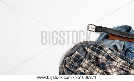 Gray Checkered Shirt, Blue Jeans, Leather Belt Top View. Mens Clothes Flat Lay Isolated On White Bac