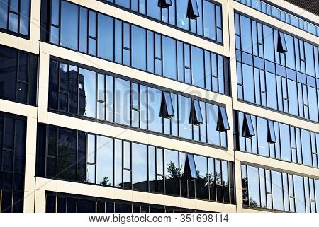 The Windows Of A Modern Building For Offices. Business Buildings Architecture.