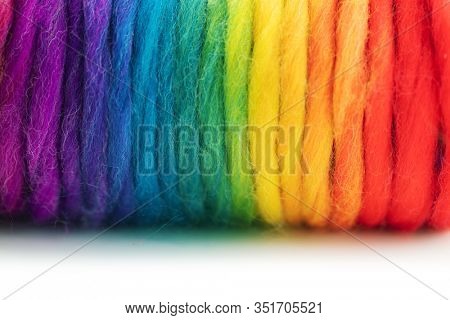Yarn in spectrum of colors. Reel of colorful yarn. Shallow depth of field.
