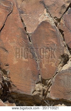 Strange Shapes And Figures That Have Been Carved Into The Ancient Sandstone Rocks At Legend Rock Sta