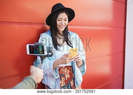Asian Trendy Woman Vlogging While Using Smartphone Outdoor - Happy Chinese Girl Having Fun With New 