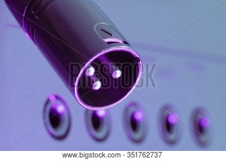 Black Male Xlr 3 Pin Connector Hanging Over Audio Device With Phone Jack Sockets. Music, Audio, Hi-f