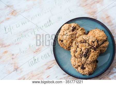 Fruit Scones - Freshly Baked Raisins And Cinnamon Scones On Vintage Plate