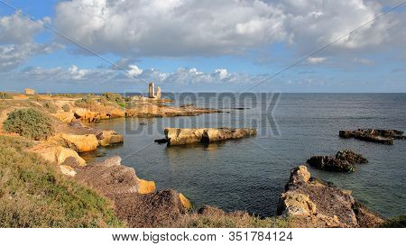 The Rocky Seashore At The Top End Of The Peninsula In Mahdia, Tunisia, With Ancient Ruins (gate To A