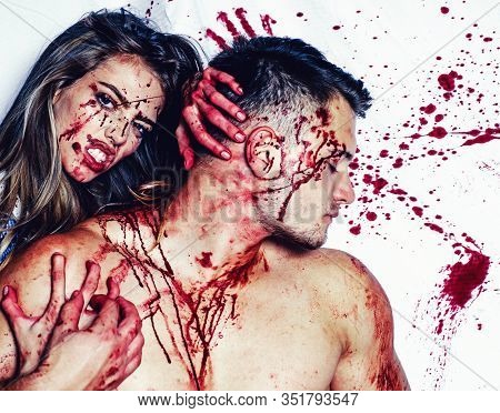 Blood Is Flowing Down The Neck, Bite Marks Are Visible. Sexy Woman Vampire Bites A Mans Neck. Woman 