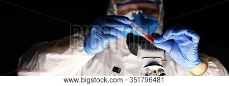 Chemical Laboratory, Man Conducts An Experiment. Analysis Drugs Based On Natural Raw Materials Plant