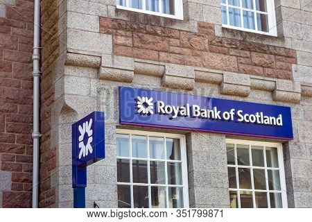 Fort William, Scotland - August 3, 2019: Old Building Of The Royal Bank Of Scotland With A Blue Mode