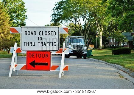 Road Closed To Thru Traffic Detour Construction Sign In A Residential Neighborhood